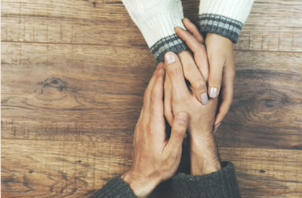 A couple holding hands and improving their communication. Couples & Marriage Counseling l St. Petersburg, FL l McNulty Counseling